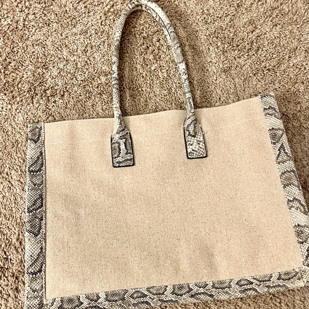 A beautiful linen tote from Express. Faux snakeskin on straps and on the sides